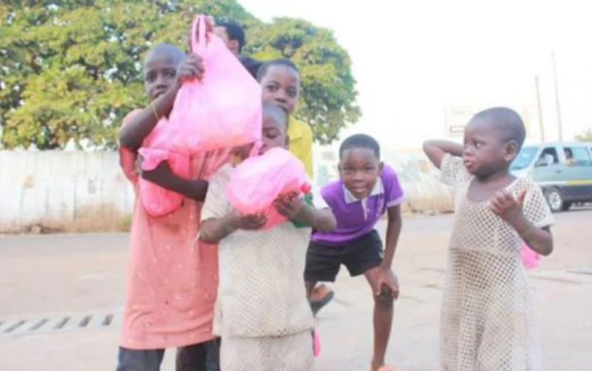 Children receiving support during an outreach activity