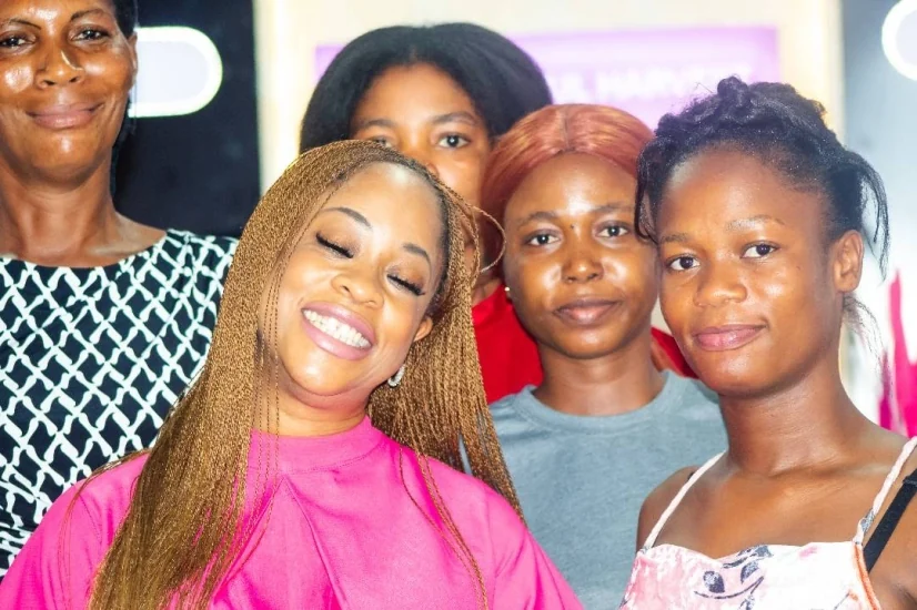 Girls gathered closely with a Blossom Foundation mentor